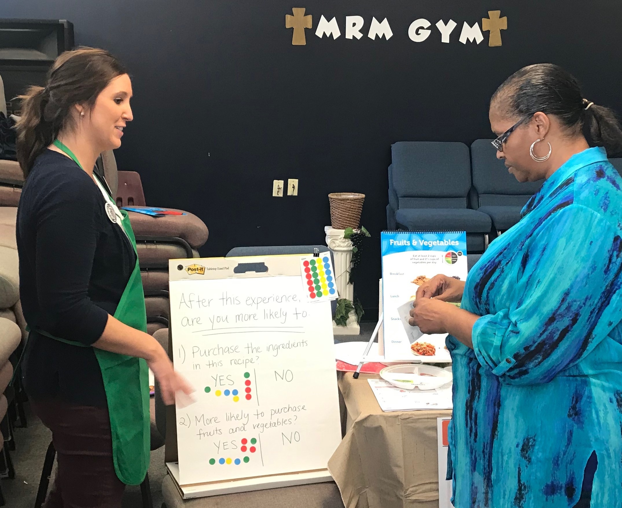 Kelsey (left) teaching nutrition.